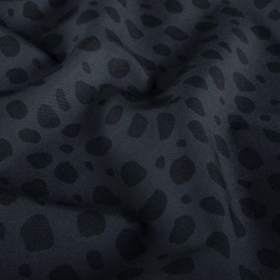 Tissu Softshell  Naya léopard Noir sur fond Gris - Par 10 cm