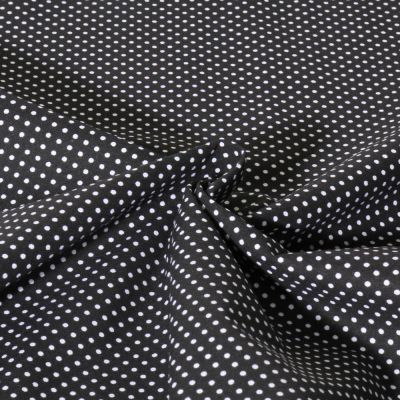 Tissu Popeline de Coton  Carmella à pois blanc sur fond Noir - Par 10 cm