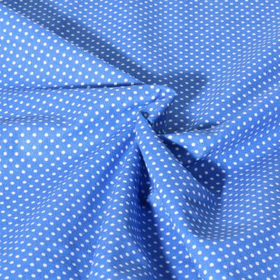 Tissu Popeline de Coton  Carmella à pois blanc sur fond Bleu azur - Par 10 cm
