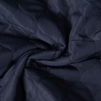 Tissu Doudoune matelassé Garance   sur fond Bleu marine - Par 10 cm