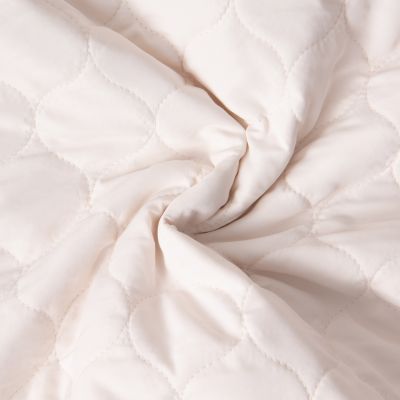 Tissu Doudoune matelassé Garance   sur fond Ecru - Par 10 cm