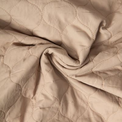 Tissu Doudoune matelassé Garance   sur fond Beige sable - Par 10 cm