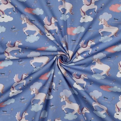 Tissu Popeline de Coton Zelhia licornes magiques sur fond Bleu - Par 10 cm