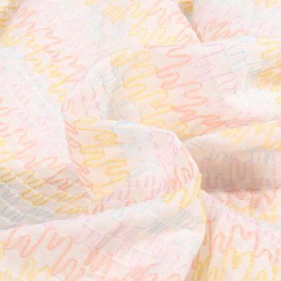 Tissu Voile de Coton brodé Zig zag pastels sur fond Blanc - Par 10 cm