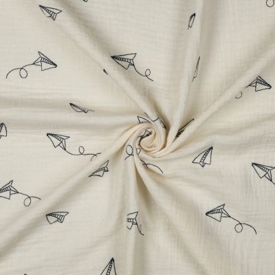 Tissu Double gaze de Coton Avions en papier brodé sur fond Ecru - Par 10 cm