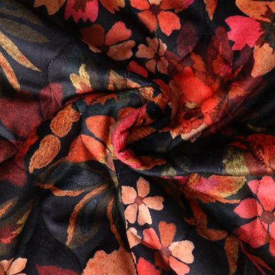 Tissu Matelassé Alba tout doux  envers doudoune fleurs Orangées sur fond Noir - Par 10 cm