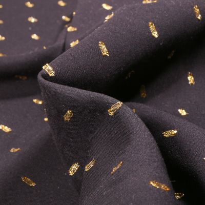 Tissu Viscose Confettis dorés sur fond Noir - Par 10 cm