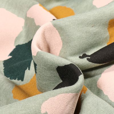 Tissu Sweat Denia sur fond Vert amande - Par 10 cm