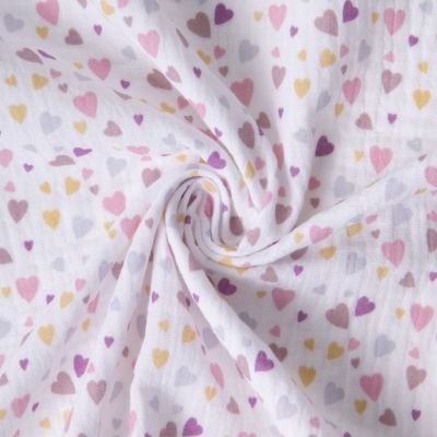 Tissu Double gaze de Coton Cotillons coeurs sur fond Blanc - Par 10 cm