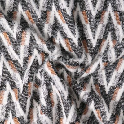 Tissu Maille chevrons duveteux Camel sur fond Noir - Par 10 cm