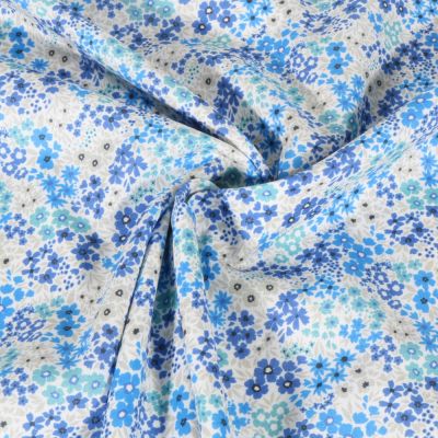 Tissu Voile de Coton digital Petites fleurs bleues sur fond Blanc - Par 10 cm