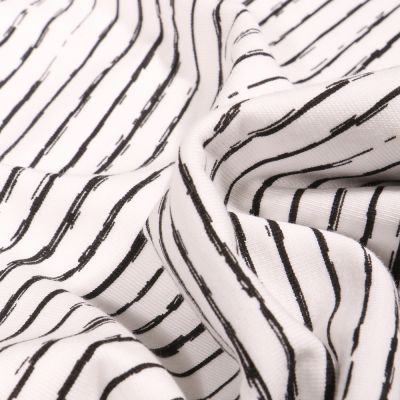 Tissu Jersey Coton Rayures destructurées sur fond Blanc - Par 10 cm