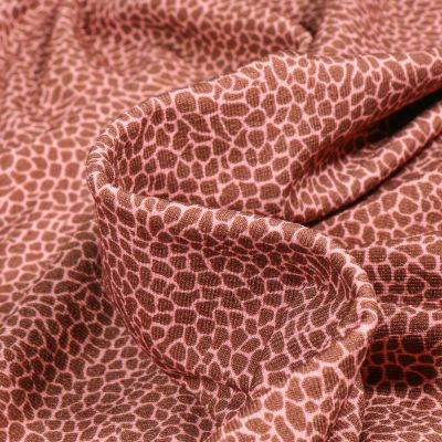 Tissu Jersey Viscose Emma Ecailles sur fond Terracotta - Par 10 cm