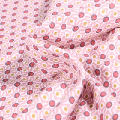 Tissu Jersey Coton Bio Alvéoles et pois sur fond Rose pâle - Par 10 cm
