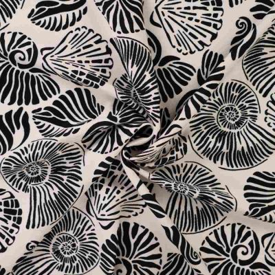 Tissu Polyviscose imprimé Îlo coquillages Noir sur fond Ecru - Par 10 cm