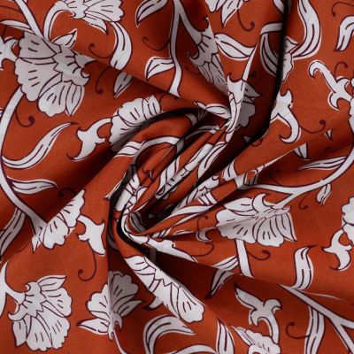 Tissu Voile de Coton Aarohi Arabesques Végétales sur fond Terracotta - Par 10 cm