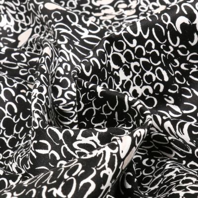 Tissu Coton Satiné extensible Merina sur fond Noir - Par 10 cm