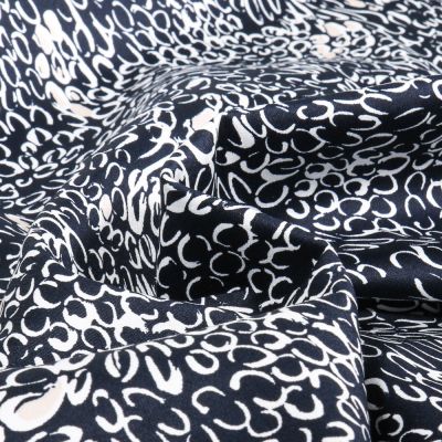 Tissu Coton Satiné extensible Merina sur fond Bleu marine - Par 10 cm