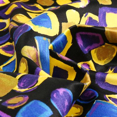 Tissu Coton Satiné extensible Formes abstraites jaune sur fond Noir - Par 10 cm
