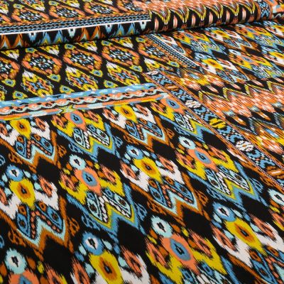 Tissu Voile de Viscose et Coton Ellen orange sur fond Noir - Par 10 cm
