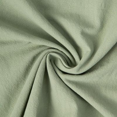 Tissu Coton Lavé aspect Lin uni Vert amande - Par 10 cm