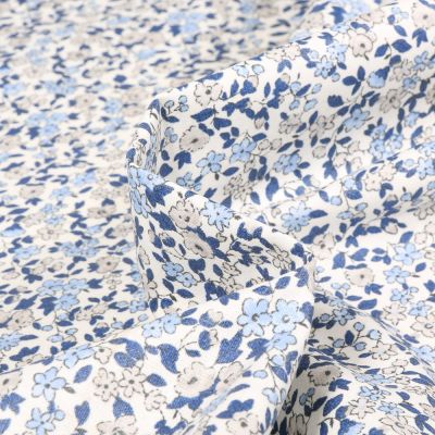Tissu Coton enduit Léonie bleu sur fond Blanc cassé - Par 10 cm