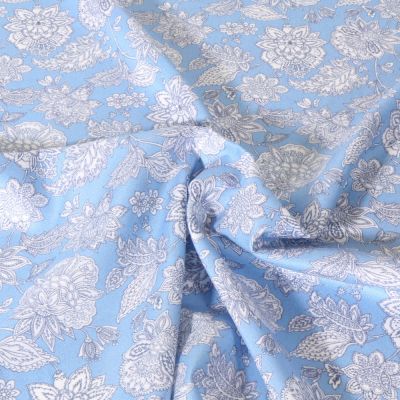 Tissu Viscose Sanfor Karma bleu sur fond Bleu ciel - Par 10 cm