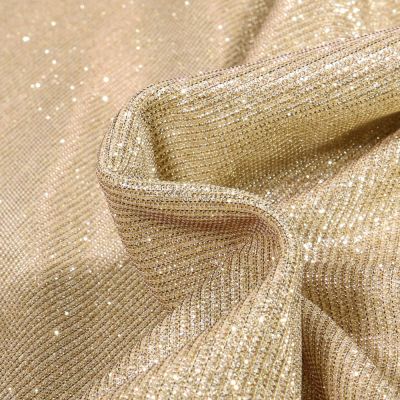 Tissu Jersey Lurex Pailleté sur fond Or - Par 10 cm
