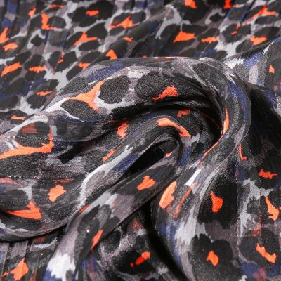Tissu Mousseline lurex Guépard néon sur fond Bleu marine - Par 10 cm