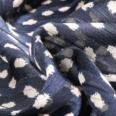 Tissu Mousseline Dots Lurex écru sur fond Bleu marine - Par 10 cm