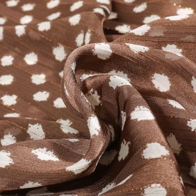 Tissu Mousseline Dots Lurex blanc sur fond Marron - Par 10 cm