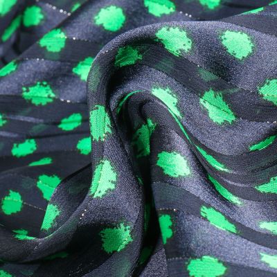 Tissu Mousseline Dots Lurex vert sur fond Bleu marine - Par 10 cm