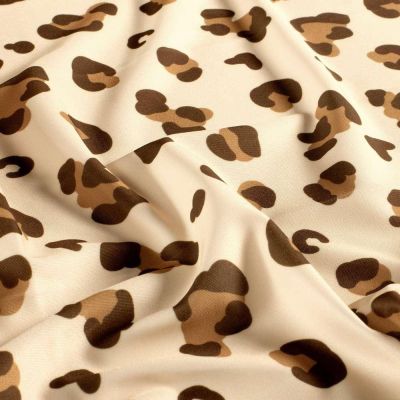 Tissu Lycra maillot de bain léopard Kaya sur fond Beige sable - Par 10 cm