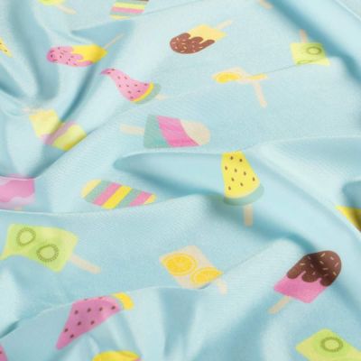 Tissu Lycra maillot de bain Fizzy sur fond Bleu pastel - Par 10 cm