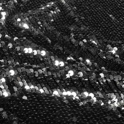 Tissu Sequins magique  Luxa extensible  sequins Argentés sur fond Noir - Par 10 cm