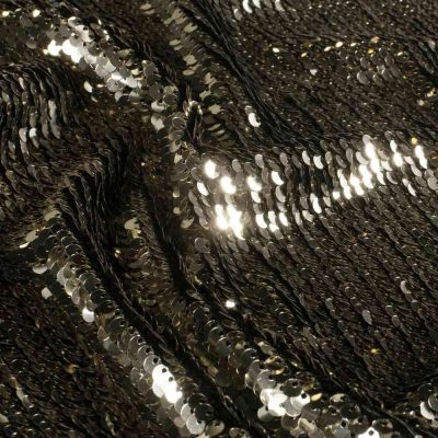 Tissu Sequins magique  Luxa extensible  sequins Dorés sur fond Noir - Par 10 cm