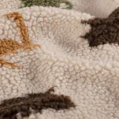 Tissu Fausse fourrure Mouton Nahla dinos Multicolores sur fond Beige clair - Par 10 cm