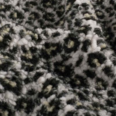 Tissu Fausse fourrure Mouton Yséa  léopard effet moucheté sur fond Blanc - Par 10 cm