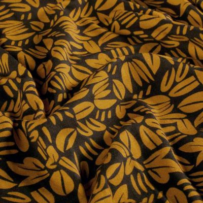 Tissu Sweat léger French Terry Emily feuillages stylisés Moutarde sur fond Noir - Par 10 cm