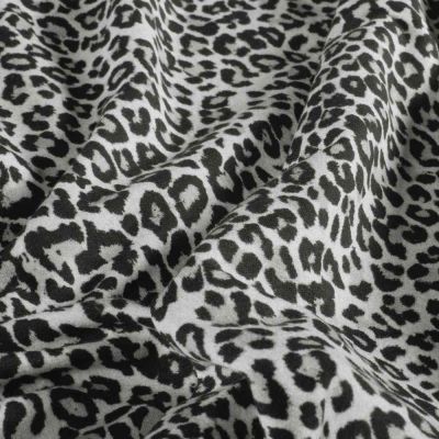Tissu Sweat léger French Terry Maïa extensible léopard Noir sur fond Blanc - Par 10 cm