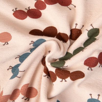 Tissu Maille Jersey Coton Baby petites chenilles sur fond Beige - Par 10 cm