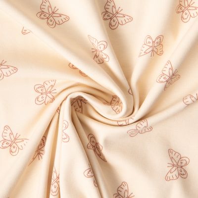 Tissu Jersey Coton imprimé Iris papillons Terracota sur fond Beige - Par 10 cm