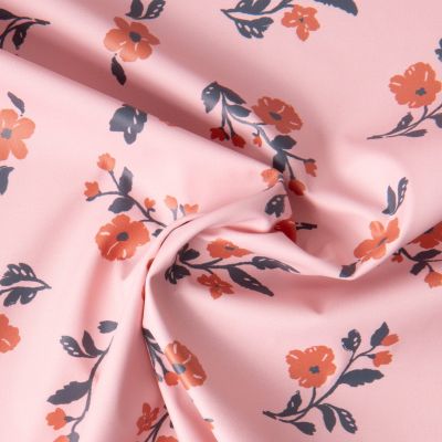 Tissu Imperméable imprimé Fleuris Caseille sur fond Rose pâle - Par 10 cm
