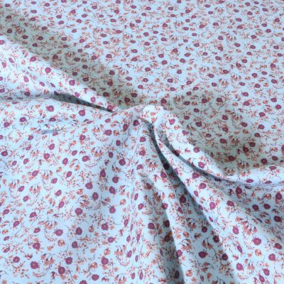 Tissu Popeline de Coton légère Motif floral sur fond Bleu ciel - Par 10 cm