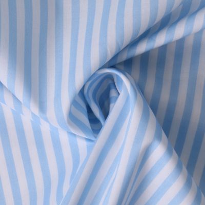 Tissu Coton imprimé  rayé Lisalou sur fond Bleu layette - Par 10 cm