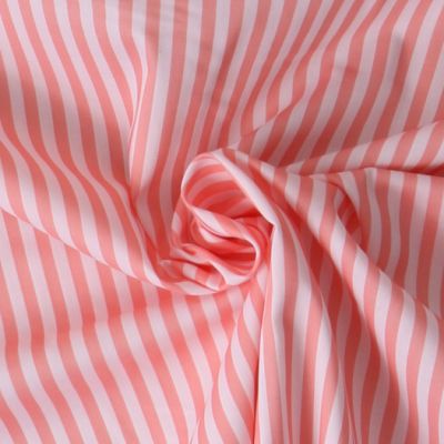 Tissu Coton imprimé  rayé Lisalou sur fond Rose saumon - Par 10 cm