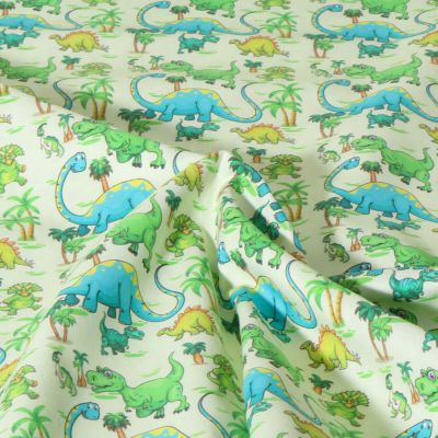 Tissu Coton imprimé Dinoland animaux sur fond Vert pâle - Par 10 cm
