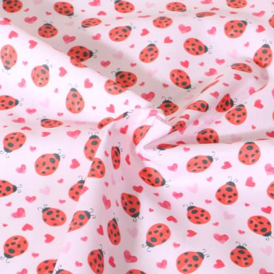 Tissu Coton imprimé Petite Chance animaux sur fond Rose pâle - Par 10 cm