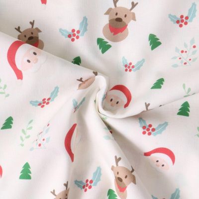 Tissu Coton imprimé  Elyna visages de pères Noël sur fond Blanc - Par 10 cm