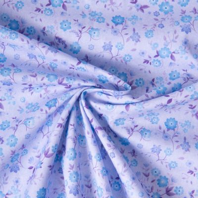 Tissu Popeline de Coton légère Petites fleurs bleues sur fond Lilas - Par 10 cm